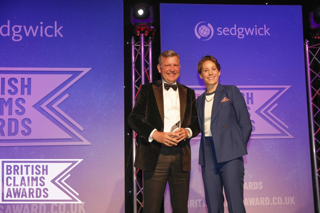 James Whittle, Managing Director of Aspray Limited, accepting the Loss Assessor of the Year award 2024 from host and comedian, Suzie Ruffell. 