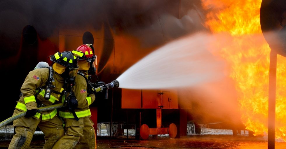 Business Safety Week : Firefighters putting out fire 