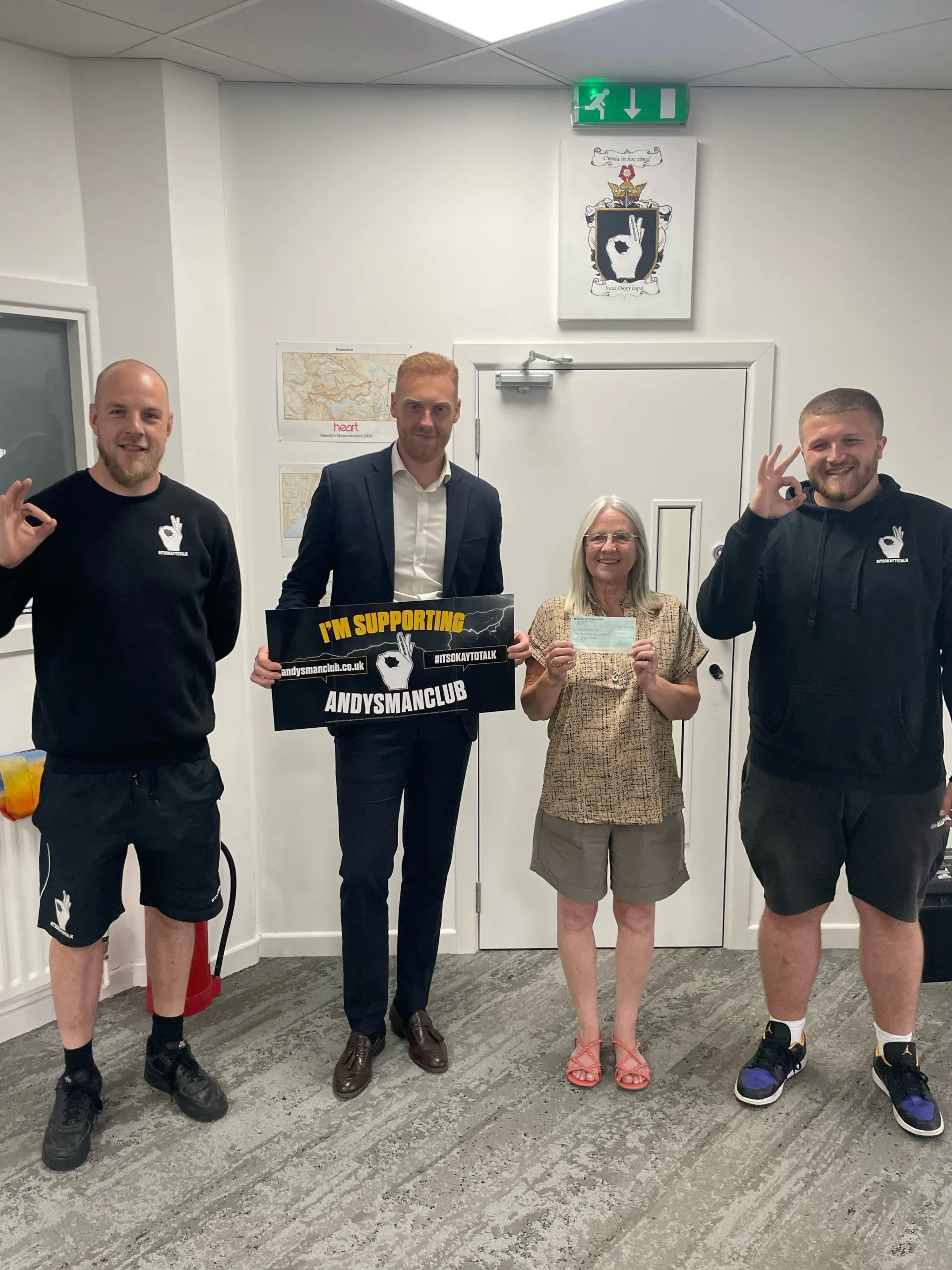 Aspray presenting the cheque for £1740 to ANDYSMANCLUB